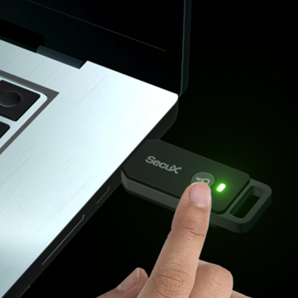 SecuX PUFido Clife Key plugged into a laptop with a finger on the confirm button and the LED lit, official SecuX image