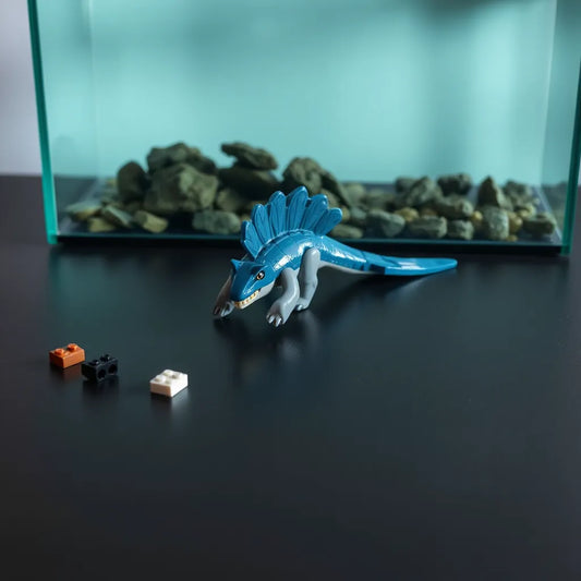 Completed LEGO Jurassic World Mosasaurus figure with articulated fins and tail on a studio tabletop