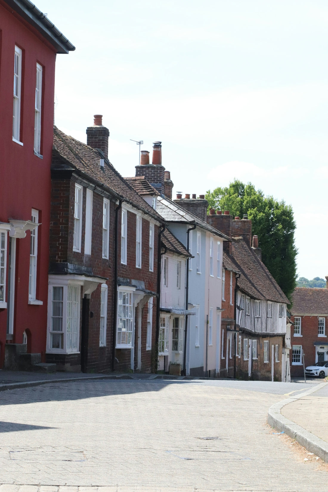 A street lined with colorful houses.