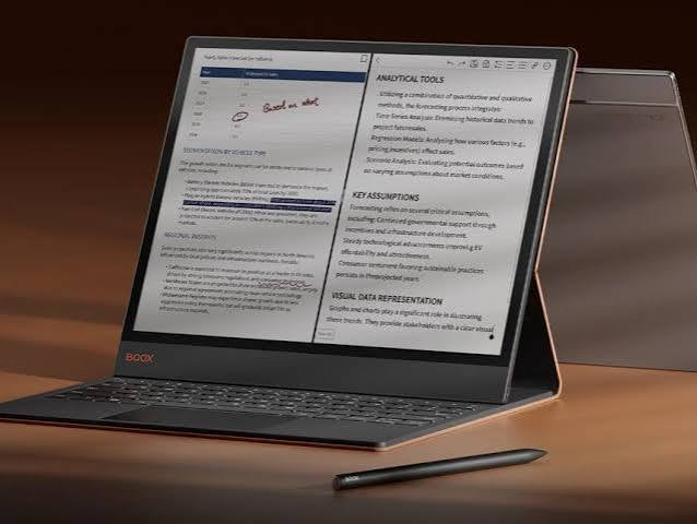 BOOX Tab X C e-ink tablet in its keyboard case as a paper-like laptop, showing split-screen document notes and handwriting with stylus