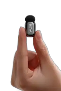 BOYA Mini 2 transmitter held between two fingers for scale