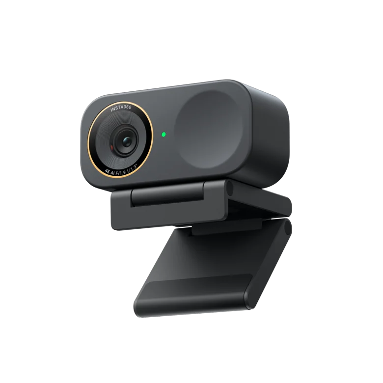 Insta360 Link 2C Pro compact AI 4K webcam in Graphite Black on its magnetic mount, front three-quarter view