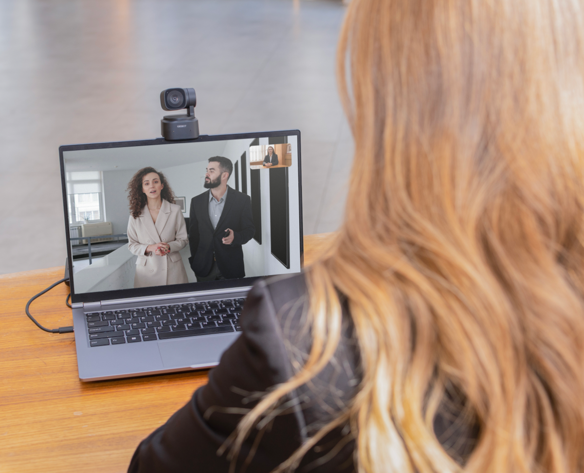 OBSBOT Tiny SE — clipped to a laptop screen during a video call