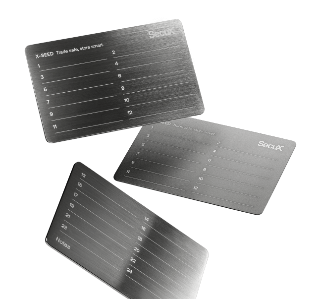 SecuX X-SEED seed plates showing numbered lines for recovery words 1 to 24 and a notes line