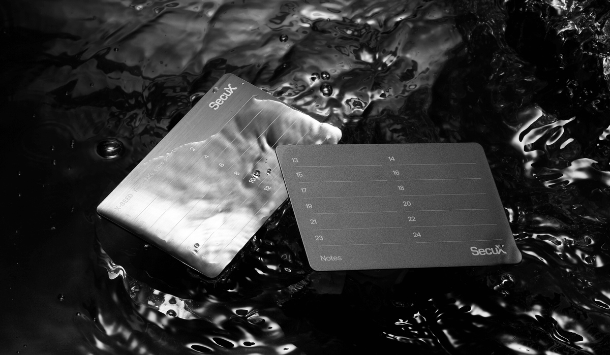 SecuX X-SEED stainless steel and aluminium seed plates lying in water