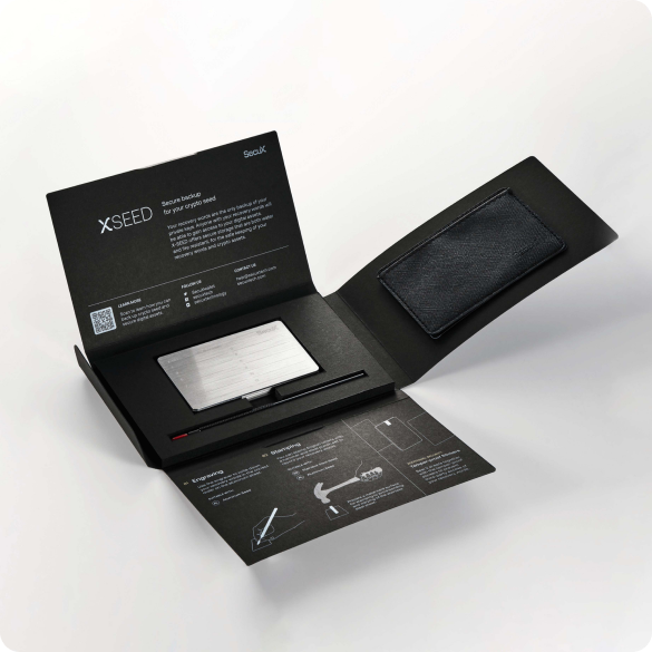 SecuX X-SEED retail packaging opened to show the plates, engraver and protective case