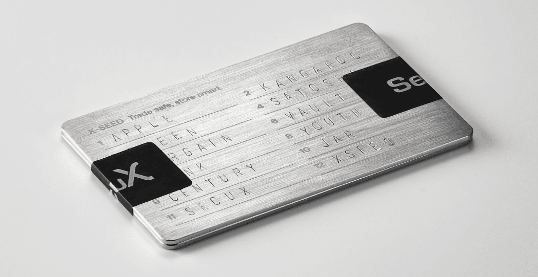 Stamped SecuX X-SEED stainless steel plates sealed together with two tamper-proof stickers